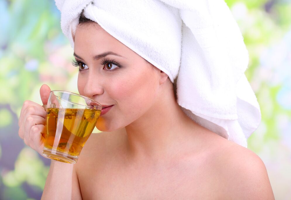girl drinking tea to rejuvenate her skin